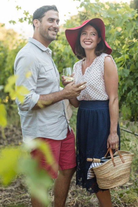 Couple with picnic basket in the vineyard at Paradise Ridge Winery
