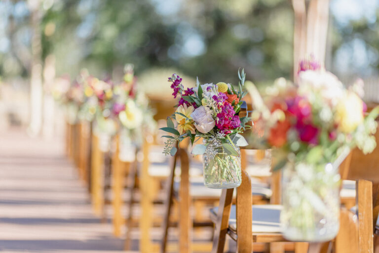 Fruitwood ceremony chairs with florals