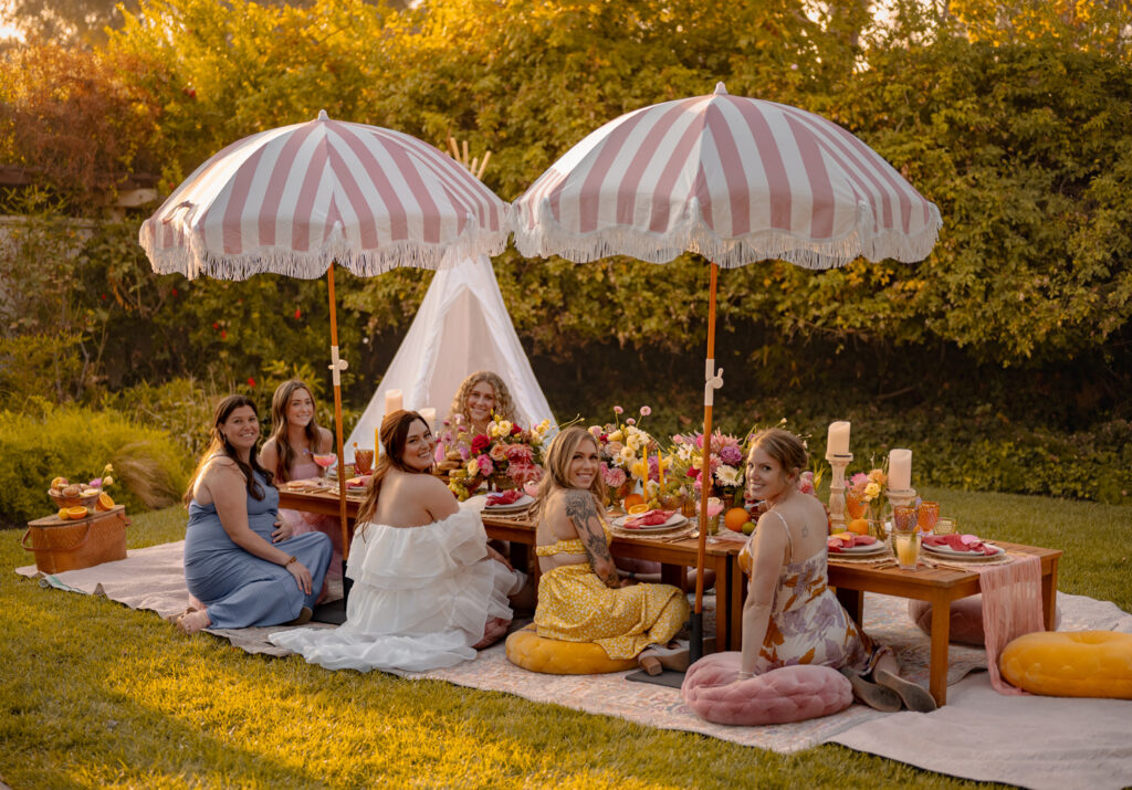 Group of women sitting on ground at a picnic