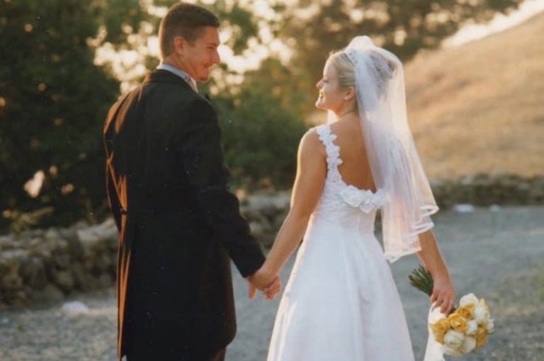 Bride and groom walking away from the camera